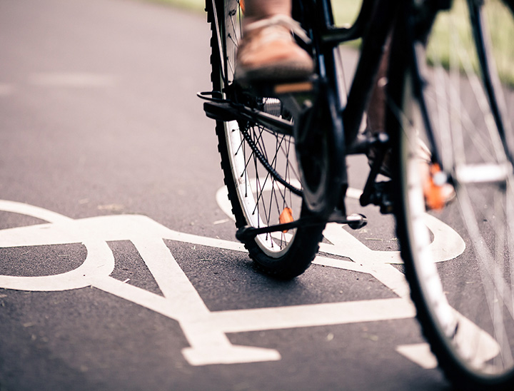 Image of person cycling on a cycle path